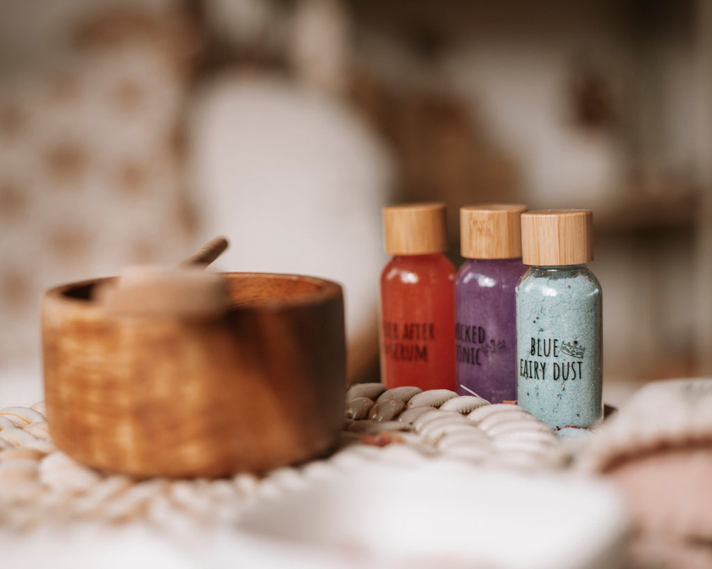 potion bottles and wooden bowl